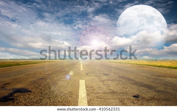 full moon and empty rural\
road