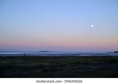 Full moon in February. Cramond beach. Scottish nature. North sea skyline. Background for an inspirational text.