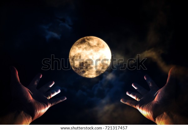 Full moon with\
hand  in Halloween\
Festival.