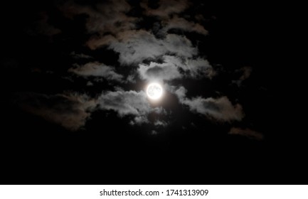 Full Moon And Lots Of Clouds. Close Up. Night Shot.