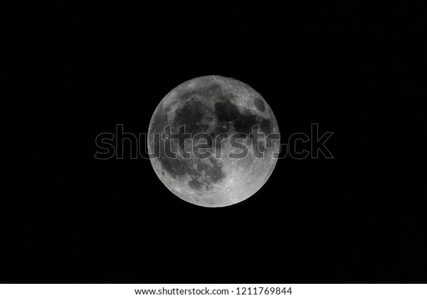 The full moon is the lunar phase when the Moon\
appears fully illuminated from Earth\'s perspective. This occurs\
when Earth is located between the Sun and the Moon. It occurs once\
roughly every month.