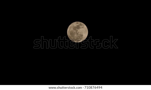 full moon at night with silhouette glass\
lawn.full moon background.\
moonlight in back background. close-up\
the moon in dark sky isolated wallpaper.with copy space and\
text\
\
