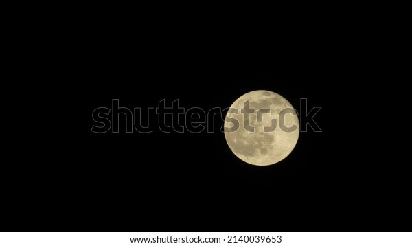 Full moon in the night sky. Black lunar background.\
Wallpaper with the moon