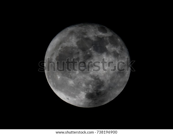 Full moon\
on black background. It is a black and white image that see details\
on the surface. Look again is awesome suitable for Halloween\
background. Moon orbit planet\
Earth.