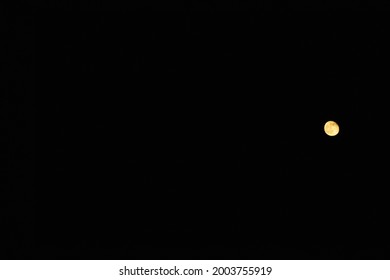 Full moon on black dark sky, copy space