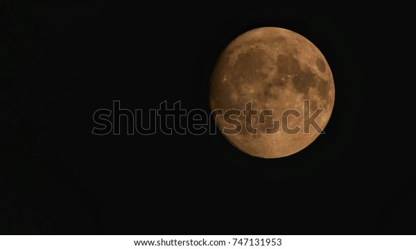 Full moon On the black\
surface