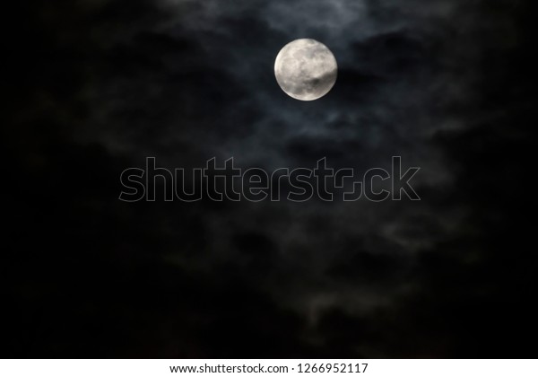 full moon on a cloudy\
night