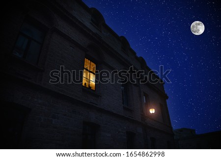 Full moon over the city at night, Baku Azerbaijan. Big full moon shining bright over buildings