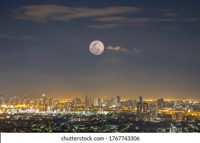 Full Moon Over City Scape In Bangkok