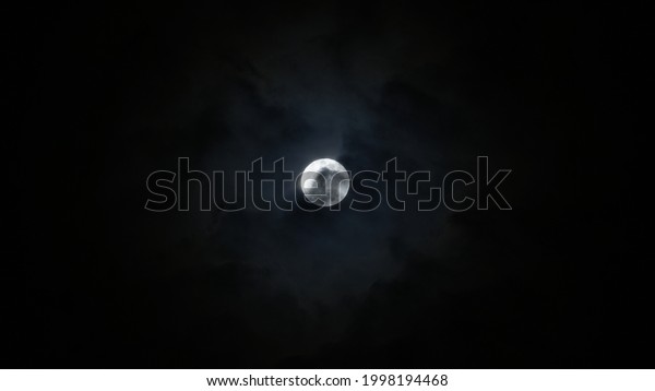 Full moon over dark
black sky at night