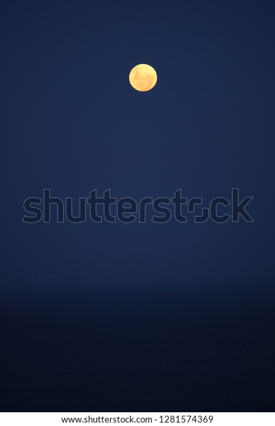 full moon over False Bay, Cape Town, South Africa,\
Atlantic Ocean