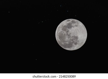 full moon over night sky with stars Orion's belt