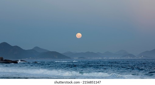 Full Moon Over Ocean And Mountain Range Landscape