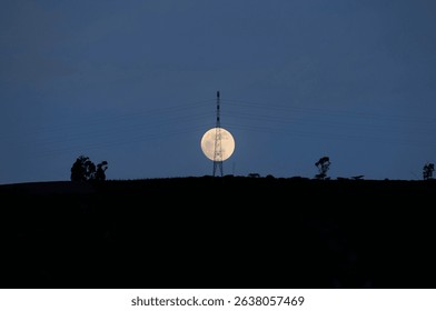 Full Moon over Power Tower at Sunset - Powered by Shutterstock - Get 15% off with code: PIKWIZARD15