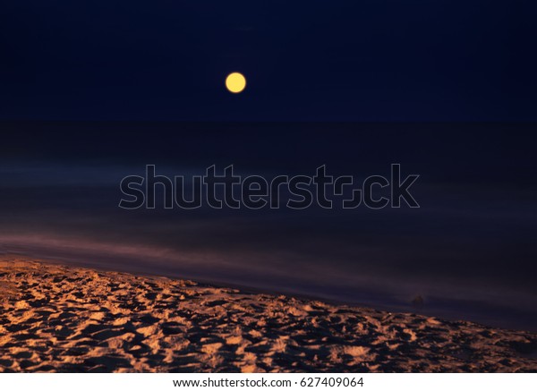 full moon over the\
sea
