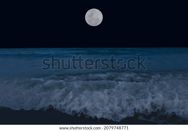 Full moon over sea in
the dark night.