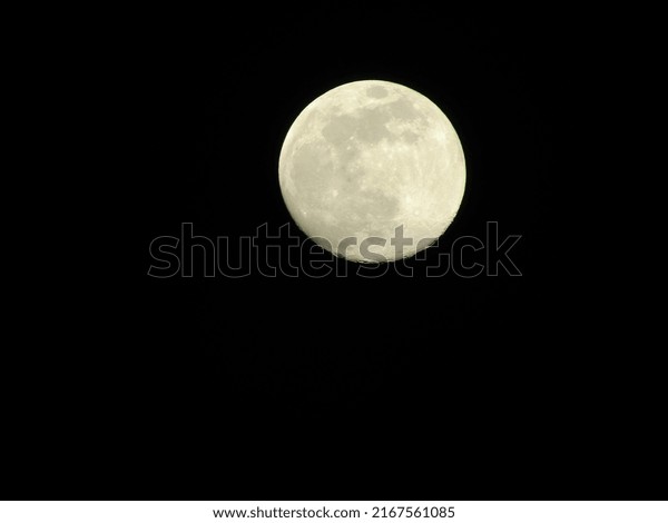 Full moon photo in a\
clear sky at night