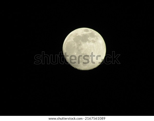 Full moon photo in a\
clear sky at night