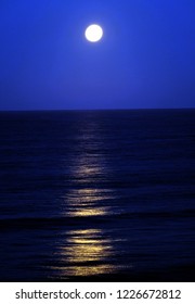 Full Moon Reflected In North Sea At High Tide. East Coast, Yorkshire, UK.