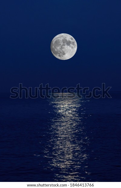 Full moon reflection over the evening sea in
Spanish Costa Brava