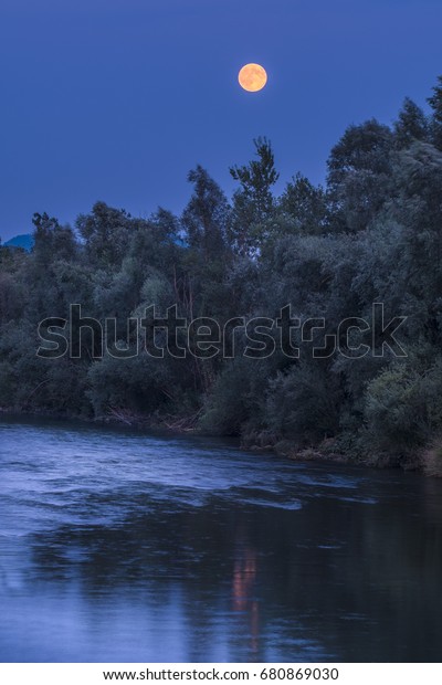 Full moon\
reflection in Sora river,\
slovenia