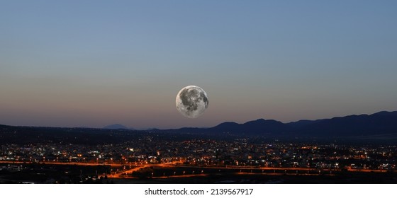 Full Moon Rise Over The City