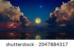 Full moon rising above serene sea in sunset sky with glowing clouds and bright stars. Elements of this image furnished by NASA