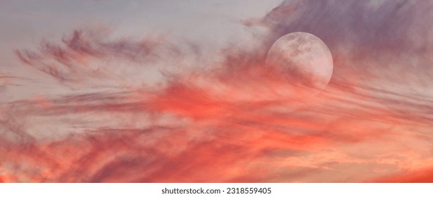 A Full Moon Is Rising In A Colorful Sunset Blue Daytime Sky Banner - Powered by Shutterstock