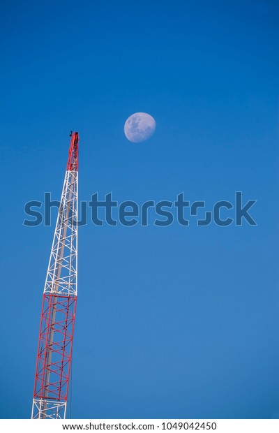 Full Moon Rising Over Colorful Construction Stock Photo Edit Now