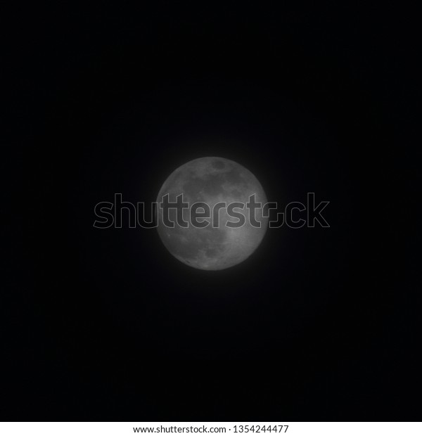 Full moon, the\
round moon against the black\
sky