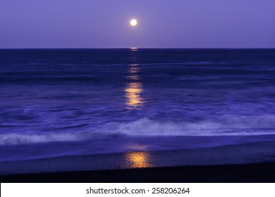 Full Moon Setting On Moonstone Beach, Along The Big Sur Highway, On The California Central Coast, Near Cambria CA.