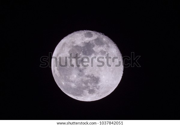 Full moon in sky at night.
Closeup