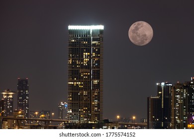 Full moon and skyscraper background