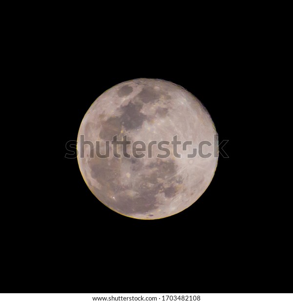 Full moon stack dark night sky. The full moon is\
lunar phase when It appears fully illuminated from Earth\'s\
perspective. It occurs when Earth is located between Sun and Moon\
appears as a circular disk