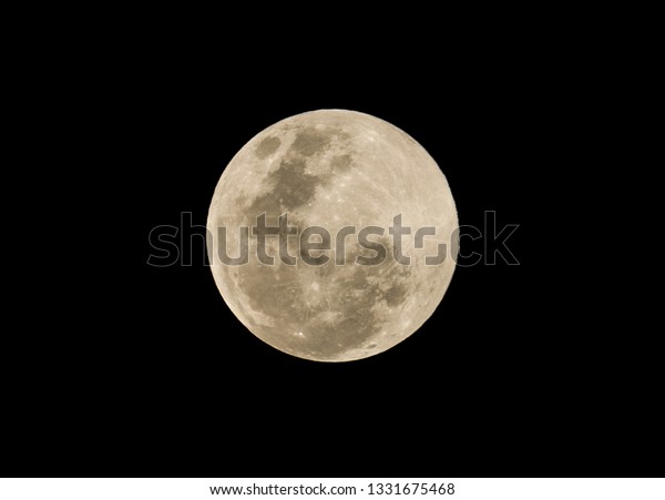 full moon\
stack photo on black dark night\
background