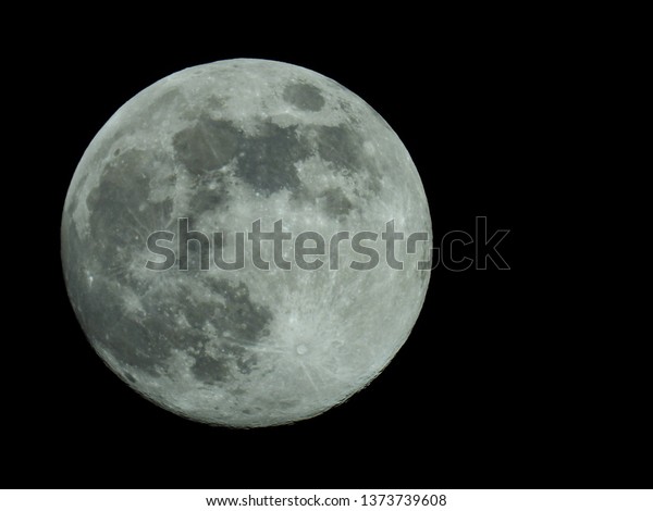 a full moon in the\
starry night sky