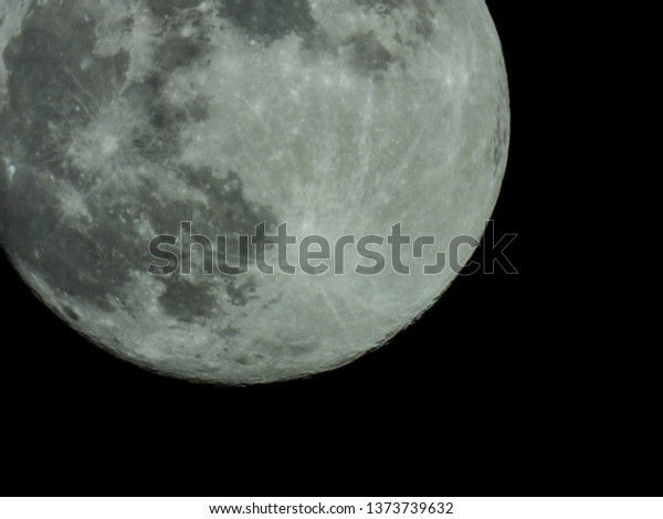 a full moon in the\
starry night sky