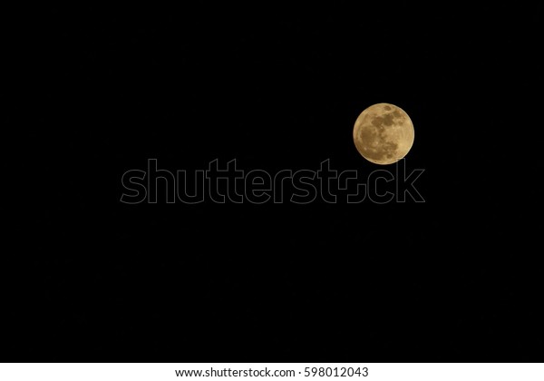 The full moon, super moon on the dark\
night. Soft focus with low key. Nature\
concept.