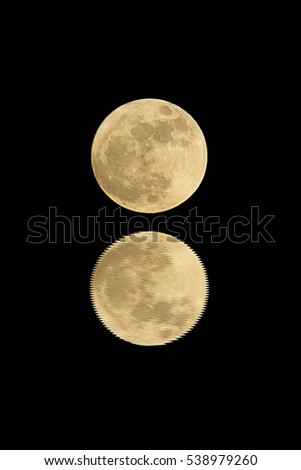 full moon with water reflection isolated on black
