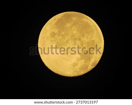 A full moon in which the surface of the moon is clearly visible, especially around the edges.  Bangkok, Thailand.  February, 2023