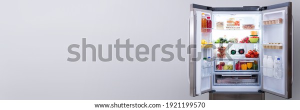 Full Open\
Refrigerator Or Fridge In\
Kitchen