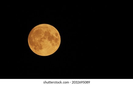 Full Orange Moon movement across the sky July 23  2021  Halloween Moon concept 
