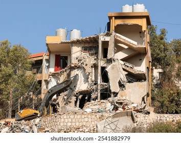 Full outdoor shot of a multi-story building undergoing demolition, showcasing various stages of collapse and the structural dismantling process in an urban setting. - Powered by Shutterstock