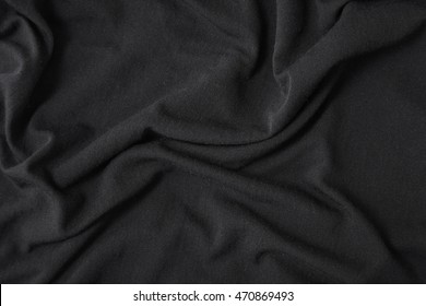 A Full Page Close Up Of Black Rippled Cotton Fabric Texture