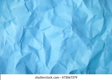 A Full Page Of Scrunched Up Bright Blue Wrapping Paper Texture