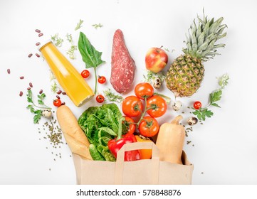 Full paper bag of healthy food on a white background. Top view. Flat lay - Shutterstock ID 578848876