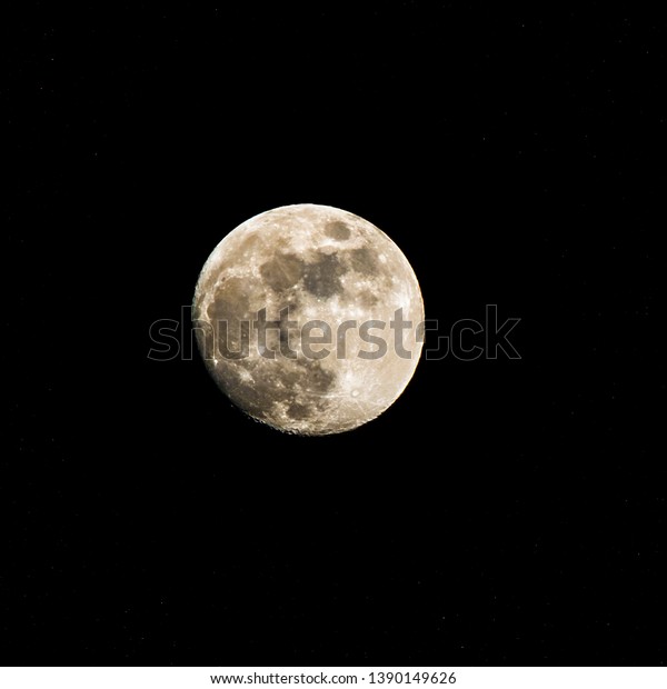 Full phase moon in a dark\
sky