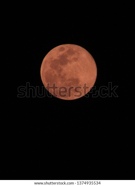 Full pink moon in the night sky, India,\
big full pink moon on Friday, close up of moon\
