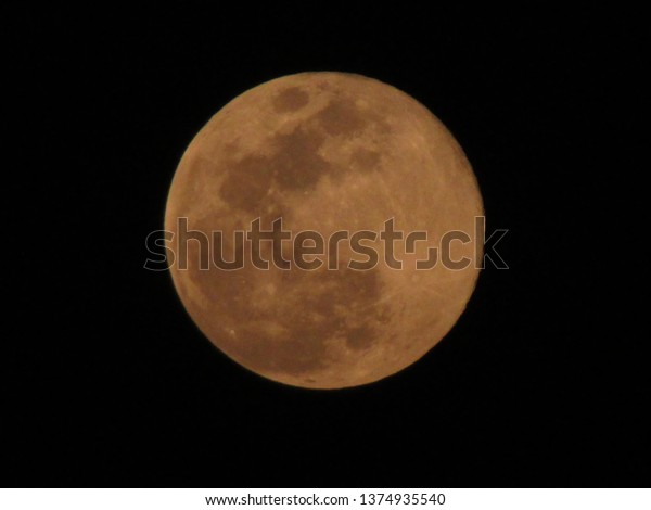 Full pink moon in the night sky, India,\
big full pink moon on Friday, close up of moon\
