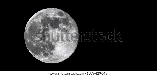 Full\
\'Pink\' Moon on Good Friday, 19th April 2019. Detailed close up\
showing details on the lunar surface with copy\
space